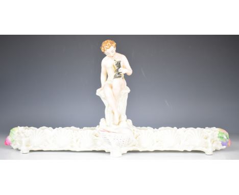 A 19thC majolica figural centrepiece / jardini&egrave;re with figure holding a small dog, Phillips and Pearce, New Bond Stree