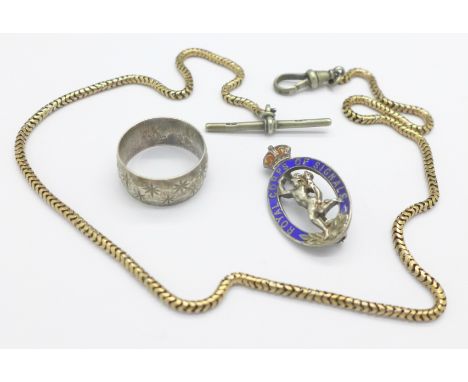 A silver and enamel Royal Corps of Signals badge, a yellow metal chain with attached silver T-bar and Albert clip, and a silv
