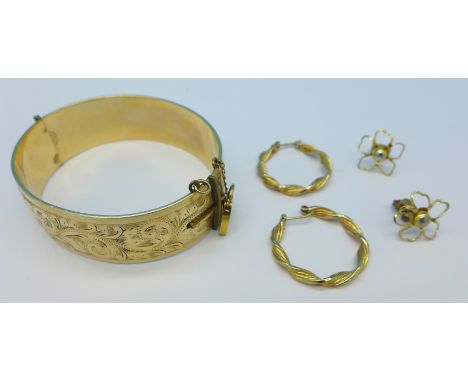 A 9ct gold and metal core bangle with 9ct gold safety lock, chain a/f, a pair of 9ct gold hoop earrings and one other pair of