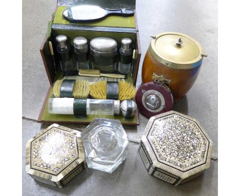 A heavy hexagonal glass inkwell, a travelling grooming set, wooden tea caddy, a/f, tape measure and two Indian style boxes