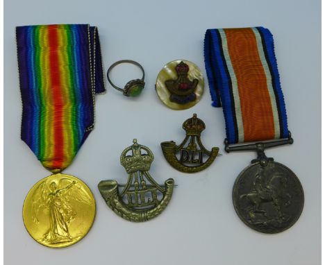 A pair of WWI medals to 77552 Pte. A. Bradbury, Durham Light Infantry with three related badges