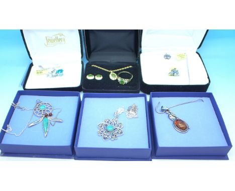 A collection of silver jewellery including a celestial ocean coated quartz, white topaz pendant and chain, a jade jewellery s