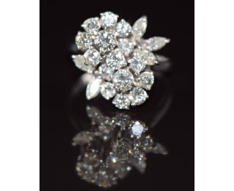 An 18ct white gold ring set with a cluster of diamonds in a floral design, the total diamond weight approximately 2.2ct, 6.3g