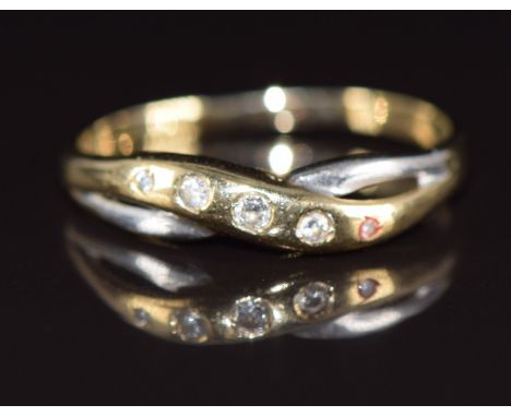 A 9ct bi-coloured gold ring set with diamonds in a twist setting, 1.4g, size R
