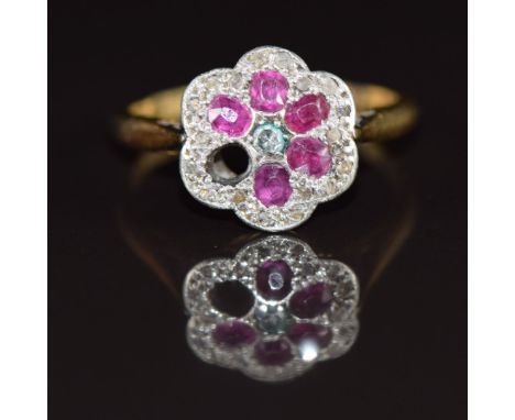 A c1920 18ct gold ring set with diamonds and rubies in a platinum flower cluster (one ruby missing), 3g, size L