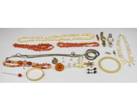 A collection of costume jewellery including rolled gold bangle, two coral necklaces, two mother of pearl necklaces, agate nec