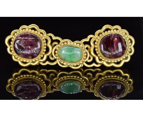 A 19thC Chinese buckle set with jadeite and ruby cabochons, 10 x 3.3cm