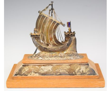 Novelty hallmarked silver model of a sailing ship or galleon with castellated bow and stern, flying an enamel flag, London 19