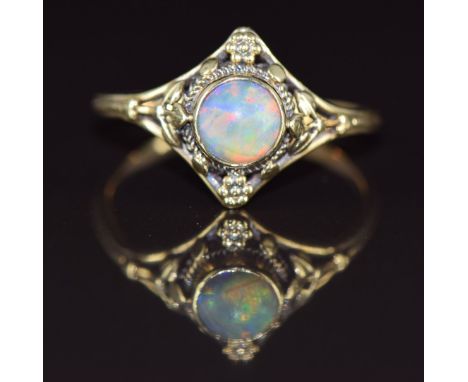 Arts &amp; Crafts 18ct gold ring set with an opal cabochon in a foliate setting, 2.6g, size O/P