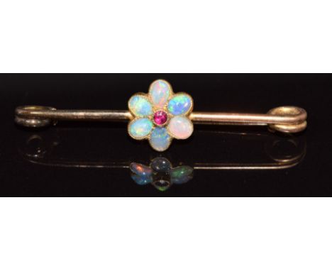 A 9ct gold brooch set with a ruby and opals in a flower setting, 2g, 3.7cm&nbsp;