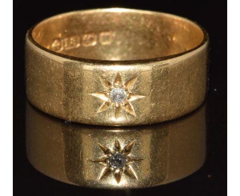 An 18ct gold ring set with an old cut diamond in a star setting, Birmingham 1921, 7g, size R