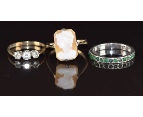 A 9ct gold ring set with a cameo (2.5g, size O), 9ct gold ring set with cubic zirconia (1.2g, size L) and a white metal etern