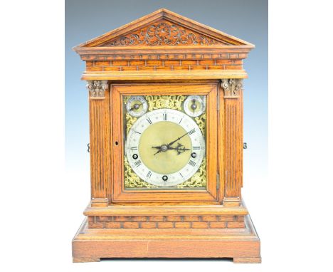 Winterhalder &amp; Hofmeier oak cased mantel clock, with silvered chapter ring, fast slow and chime silent dials, the three t