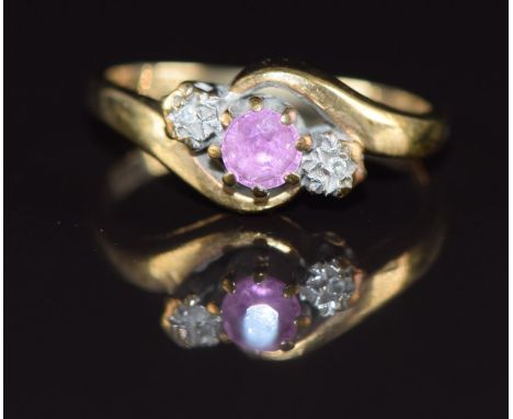 A 9ct gold ring set with a pink sapphire and diamonds, 2.3g, size L