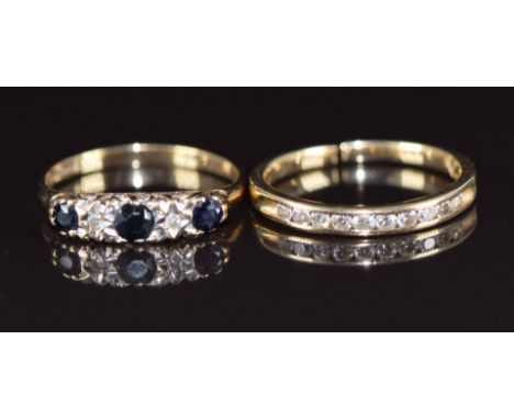 A 14k gold half eternity ring set with diamonds (1.7g, band has been cut) and a 9ct gold ring set with diamonds and sapphires