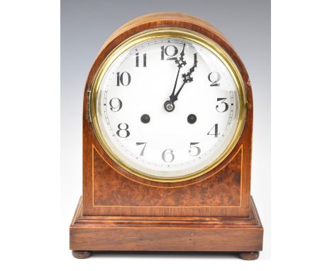 Late 19th or early 20thC mahogany cased mantel clock raised on four turned feet, the white enamel dials having Arabic numeral
