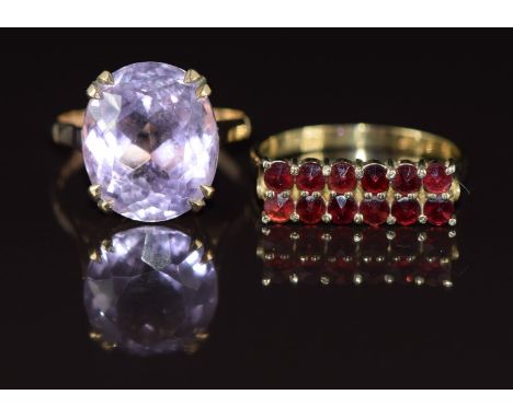 Two 9ct gold rings, one set with an oval cut amethyst one with two rows of garnets, 7g, size O &amp; M
