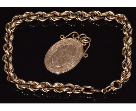 A 9ct rose gold pendant with engine turned decoration (2.8g, 3 x 1.8cm) and a 9ct rose gold rope twist bracelet (8.5g, 18cm l