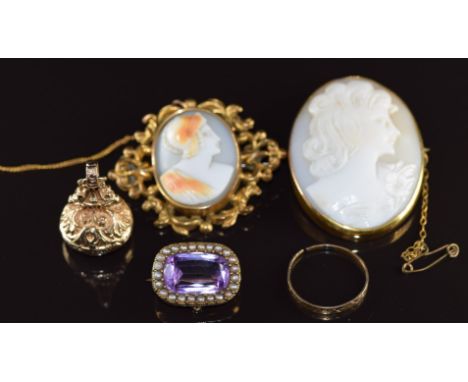 A 9ct gold fob / seal set with smoky quartz, Edwardian brooch set with an amethyst surrounded by seed pearls, yellow metal ri