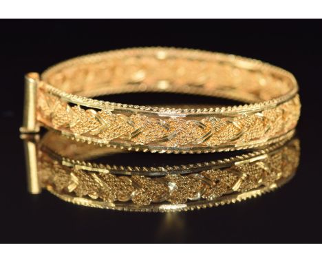 A 22k gold Indian bangle in a plaited design, 27.7g, 5.8cm