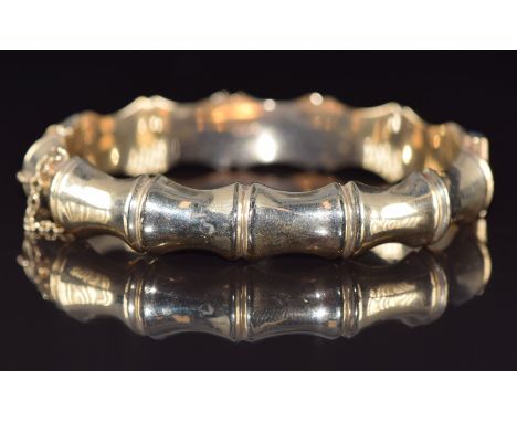 A 9ct gold bamboo bangle by L &amp; Co, 17.6g, 6 x 5.3cm