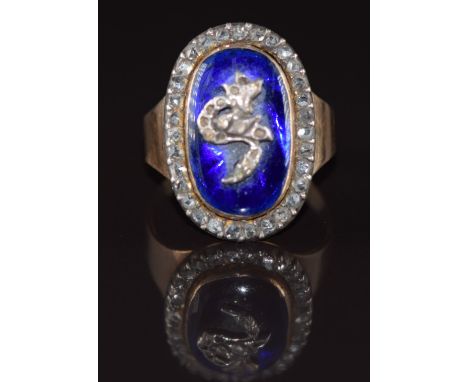 An early 18ct gold Victorian ring set with blue enamel and a border of rose cut diamonds, 5.9g, size O