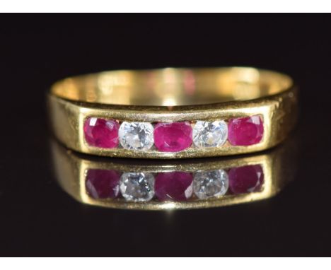 An 18ct gold ring set with three rubies and two diamonds, 3.2g, size S