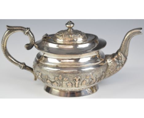 Indian or similar silver plated teapot with embossed decoration of figures and animals in landscapes, height 11.5cm