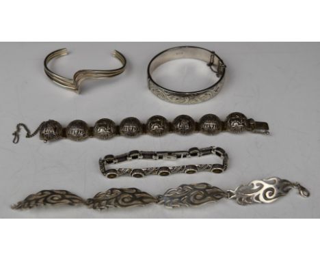 Four silver bracelets and a silver bangle by Excalibur&nbsp;