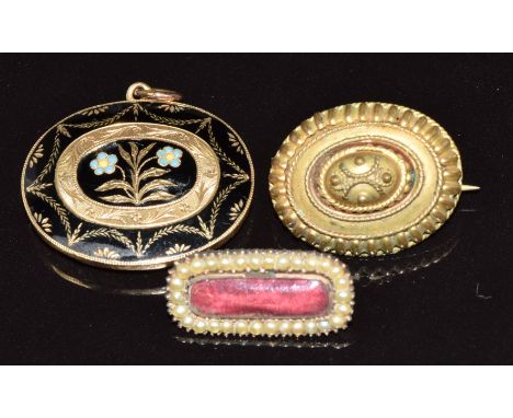 Victorian mourning locket set with black enamel in a floral design, verso a glass locket (7.8g), Victorian brooch set with se