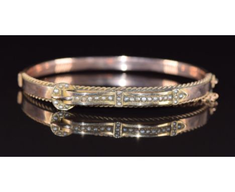Edwardian 9ct rose gold bangle set with seed pearls in a buckle design, 8.1g, 5.5 x 4.5cm
