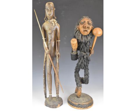 African tribal figures including intricately carved figure with knobkerrie, tallest 67cm