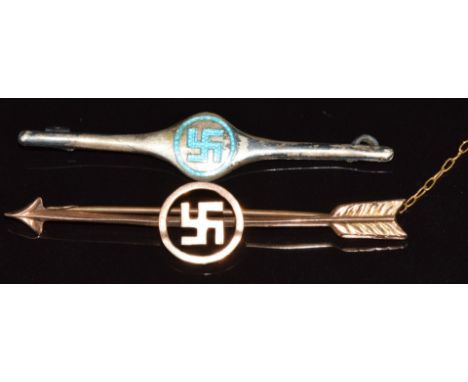 A 9ct gold swastika brooch (1g) and a silver brooch set with blue enamel in the form of a swastika&nbsp;