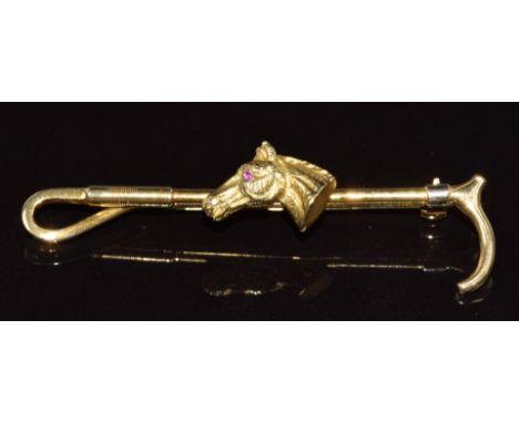 A 9ct gold bar brooch in the form of a horse's head set with a ruby eye and crop, 6.7g, 5.7cm&nbsp;