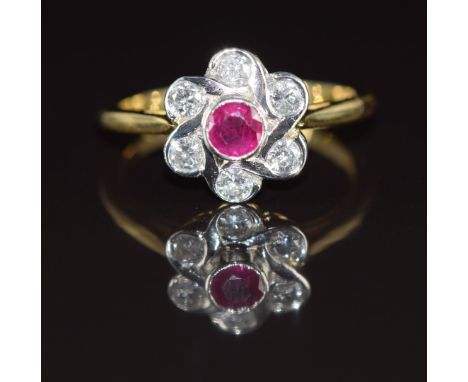 An 18ct gold ring set with a ruby of approximately 0.3ct and diamonds&nbsp;totalling approximately 0.58ct in a platinum setti