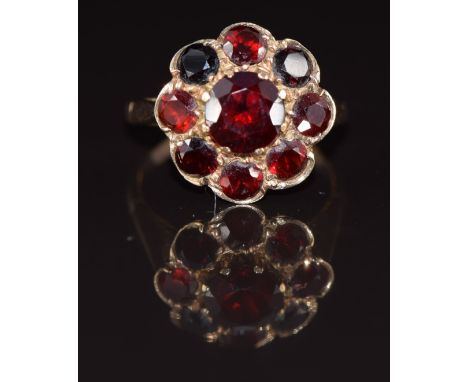 A 9ct gold ring set with a cluster of&nbsp;garnets, 3.8g, size M