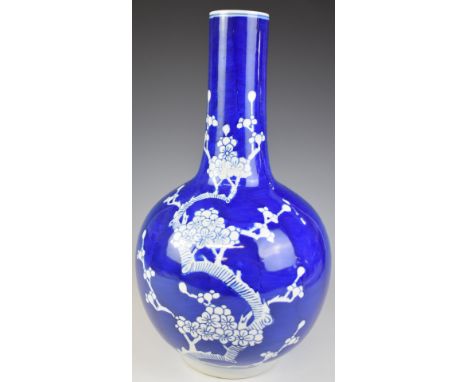 Chinese bottle vase with blue and white prunus decoration and seal mark to base, height 46cm