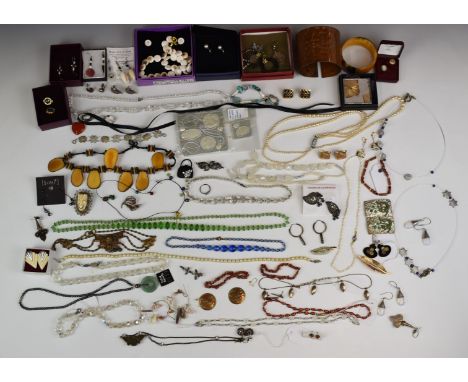 A collection of costume and vintage jewellery including earrings, shell necklace and earrings, silver earrings, vintage earri