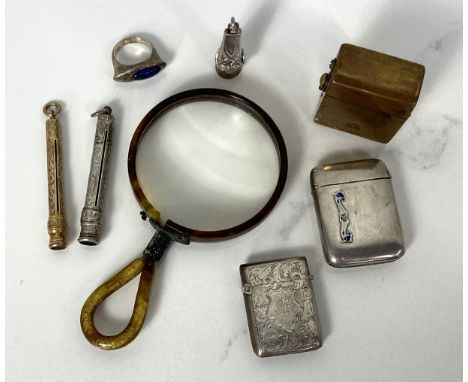 A selection of small silver objects and related items, including two vesta cases, two pencils, a ring, magnifying glass an ot