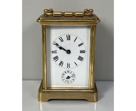 A brass cased carriage alarm clock, with four glass case, the enamel dial with subsidiary alarm dial, key included, 12cm high