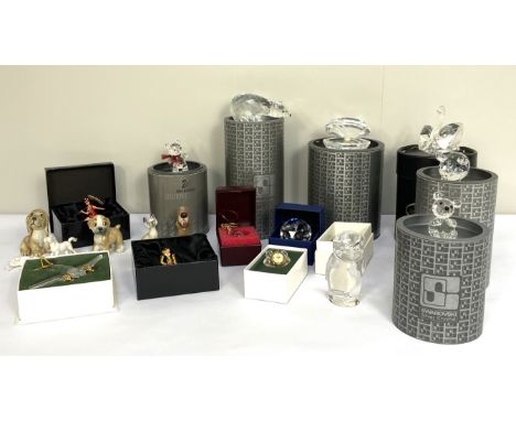 Assorted Swarovski crystal figures, including bears, in cased collectors boxes, also four small Disney ceramic figures, 2 sma