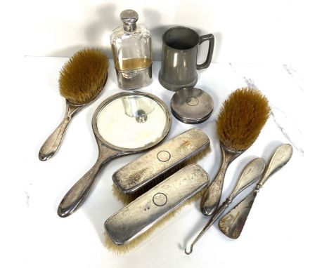 An Edwardian silver backed dressing table set, hallmarked London, circa 1918, with engine turned decoration, comprising two p