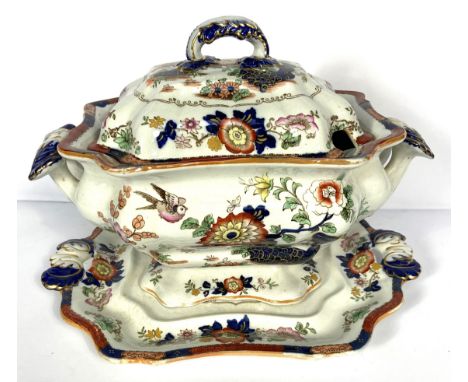 A large Victorian ironstone tureen, cover and stand, by Ashworth Brothers, decorated with flower sprays; also two oval ashets