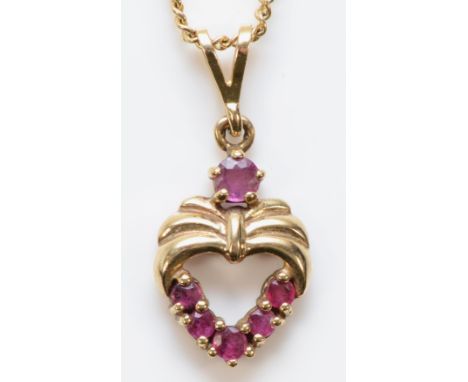 A 9ct gold ruby heart pendant with a chain, 15mm pendant length, 3.8g