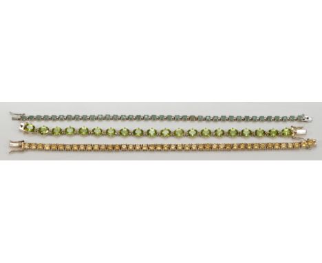 A QVC silver and peridot line bracelet, 18cm another with yellow stones, 19.5cm and a 925 silver bracelet, 36gm, (3)