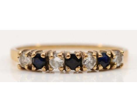 A 9ct gold sapphire and cubic zirconia half eternity ring, M, 1.2g