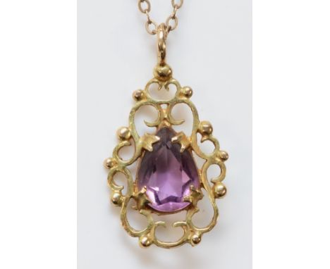 A 9ct gold and amethyst pendant with a chain, 10mm x 6mm amethyst, 2.4g