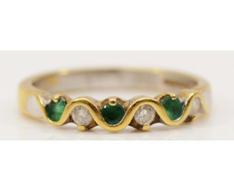 An 18ct gold emerald and diamond half eternity ring, N, 3.2g