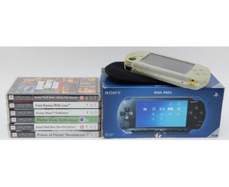 A PSP console, model no. PSP-1003 G1, boxed, together with six games, to include, Prince of Persia Revelations, Grand Theft A