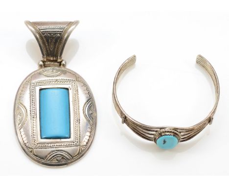A Native American silver and turquoise pendant, 8cm and a similar bracelet, (2), 54gm